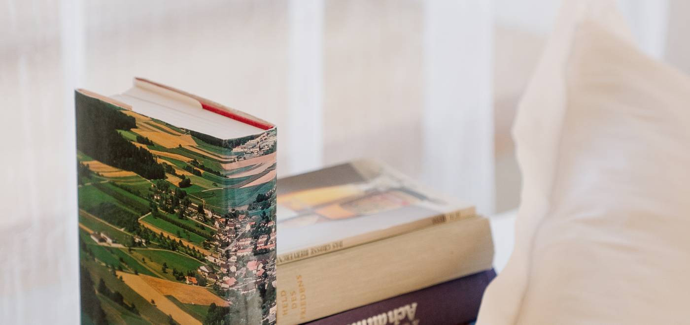 Books on the nightstand in a room in the B2 Hotel in Zurich