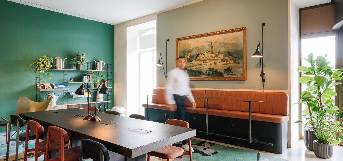 A person walks through the coworking space of the B2 Hotel Zurich