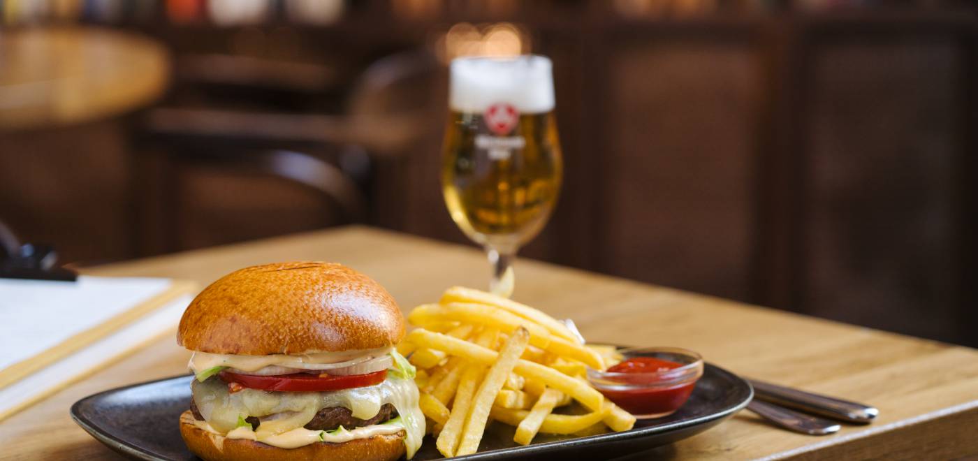 Homemade burger with fries and a cold beer