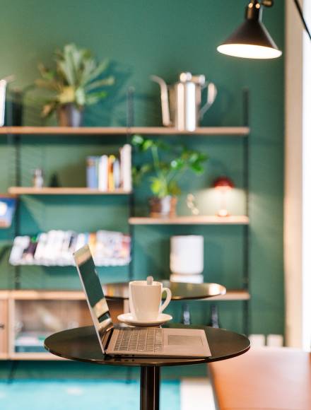 Laptop on a table in the coworking space at the B2 Hotel in Zurich