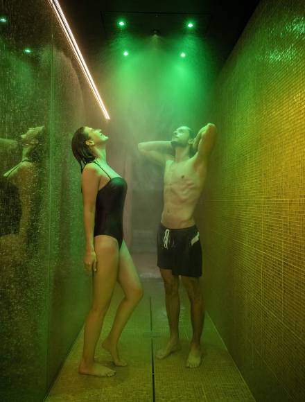 Couple in the sensory shower at the Huerlimann Spa in Zurich