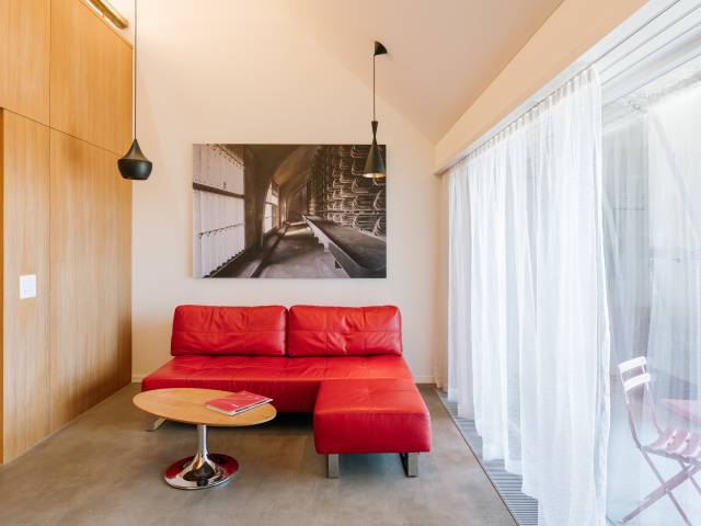 Red sofa in a room at the B2 Hotel Zurich